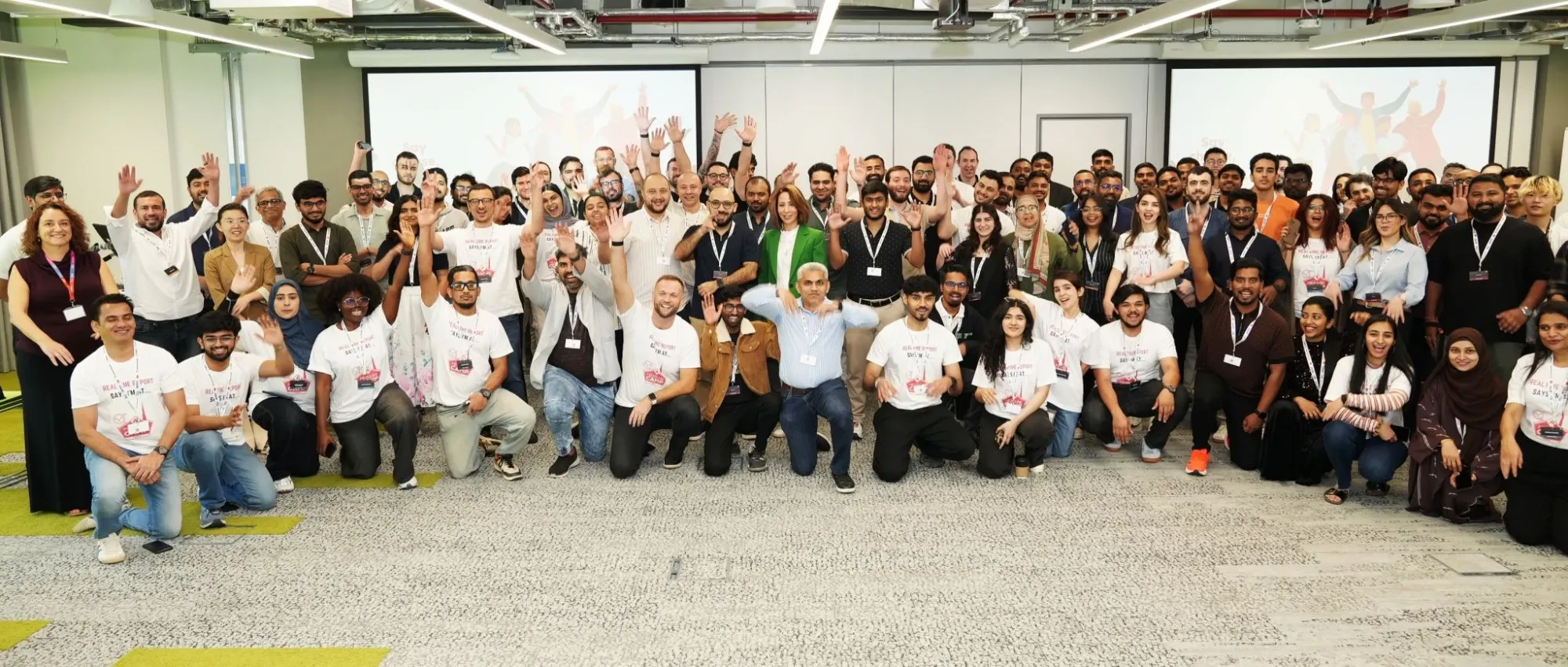 MeasureCamp Dubai 2025 attendees waving in a group photo
